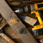 yellow cordless drill on a workbench